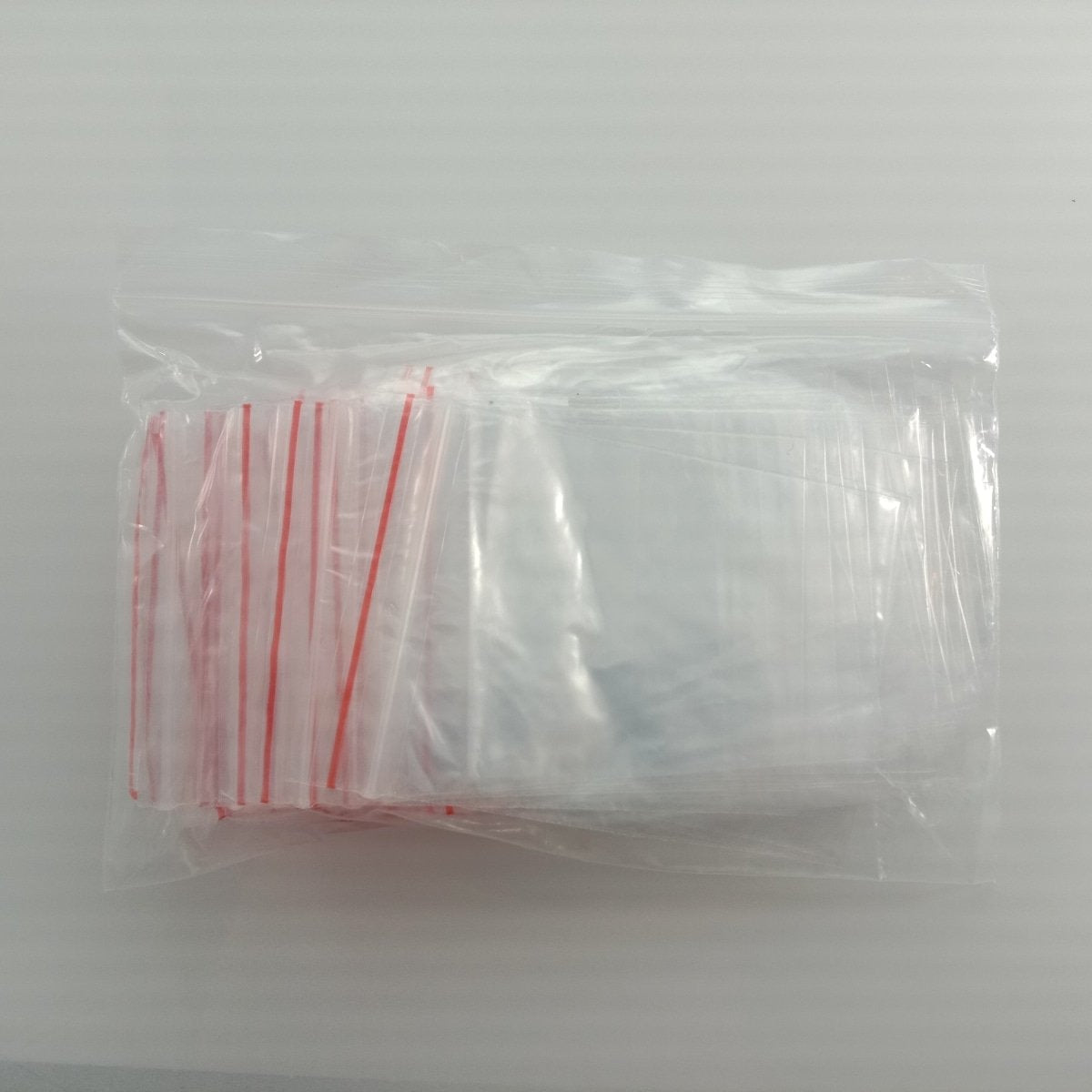 100pcs 6x8cm Clipseal Sealer Small Plastic Zip Bags Thin Satchels - - Asia Sell