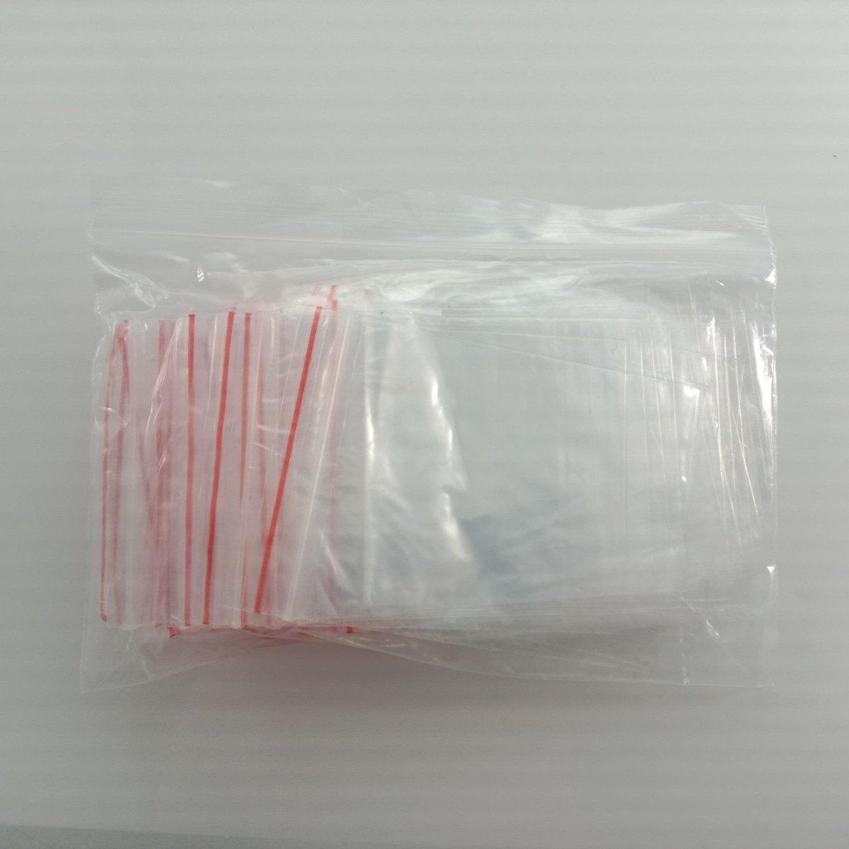100pcs 6x8cm Clipseal Sealer Small Plastic Zip Bags Thin Satchels - Asia Sell