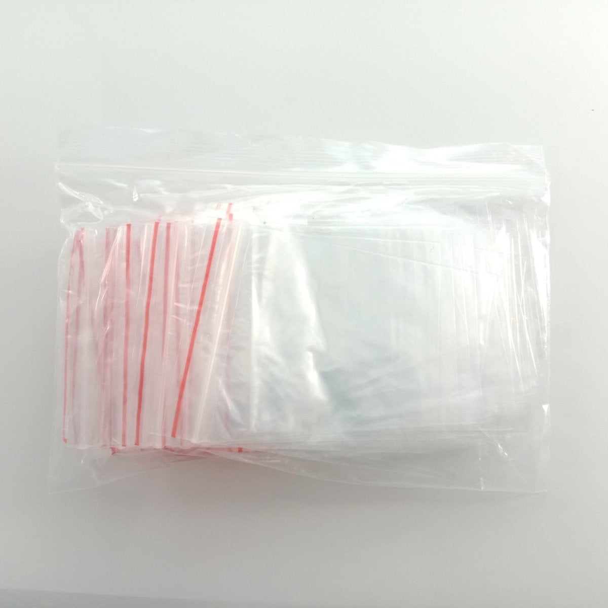 100pcs 6x8cm Clipseal Sealer Small Plastic Zip Bags Thin Satchels - - Asia Sell