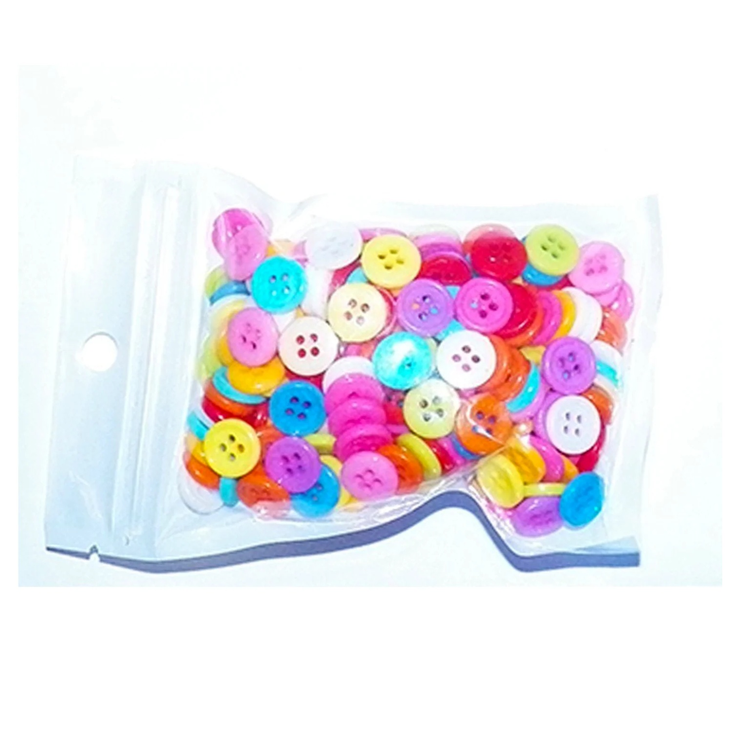 Assorted colorful buttons in a clear plastic bag on a white background