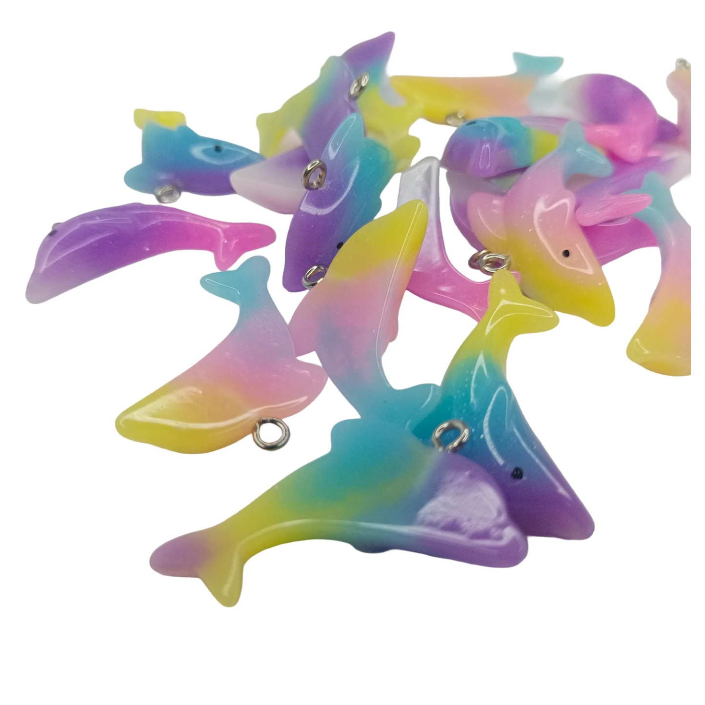 Colorful dolphin-shaped toys on a white background