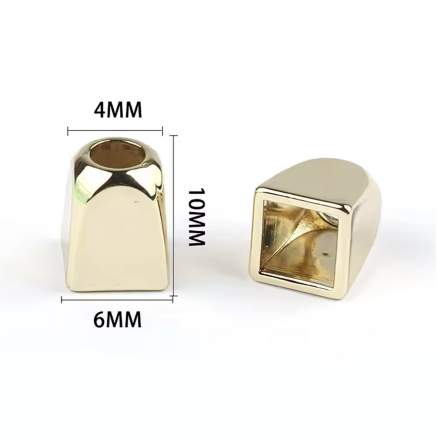 Two gold coloured metal rope pull ends with measurements on a white background