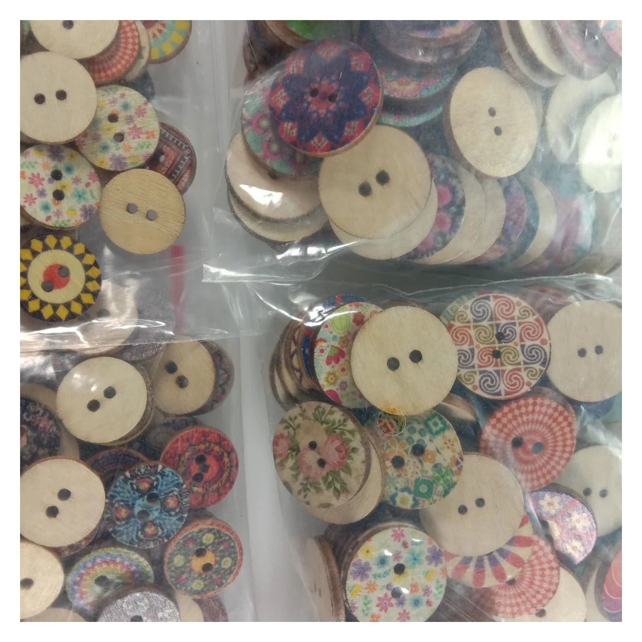 Assorted wooden buttons with floral and patterned designs in clear bags.
