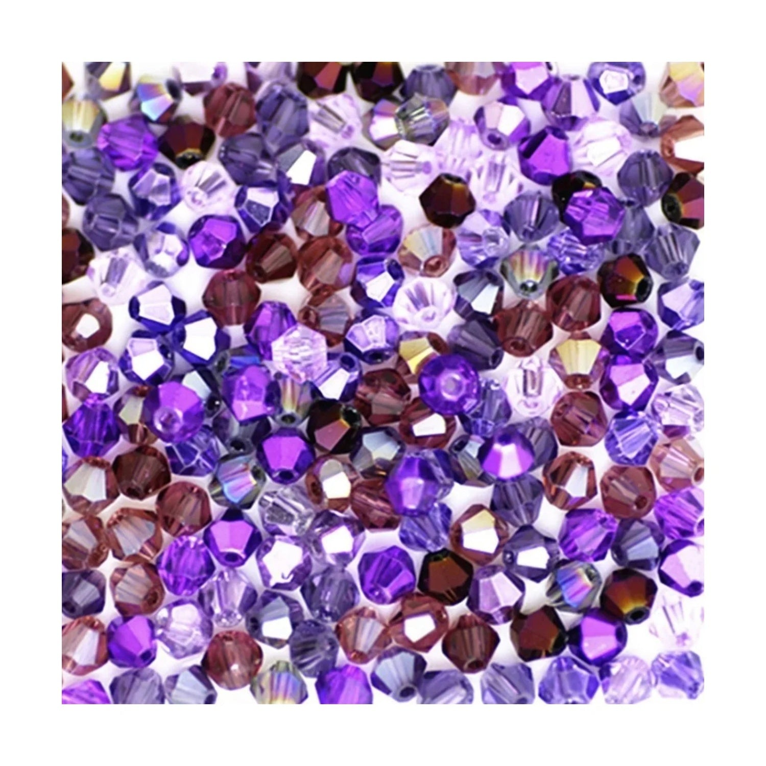Assorted purple and brown beads on a white background