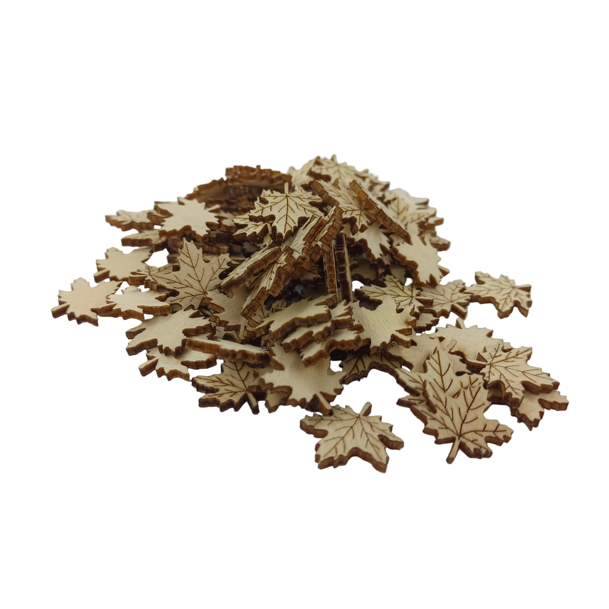 A pile of small laser-cut wooden leaf-shaped pieces in a light natural wood tone, arranged on a plain white surface.