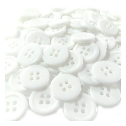 White buttons scattered on a white background