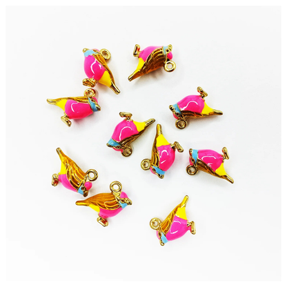 Pink and gold bird-shaped charms on a white background