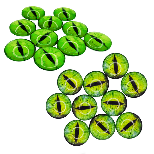 Green and black glass eyes arranged on a white background