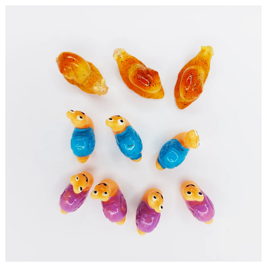 Colorful snail figurines on a white background