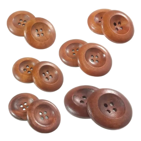 Round wooden buttons with four holes, varying in size from 10mm to 25mm, in shades of medium brown and reddish-brown, arranged on a plain white background.