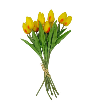 A bouquet of artificial yellow tulips with green leaves and stems, tied with a simple string, displayed on a white background.