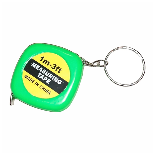 Miniature green measuring tape with keyring on a white background