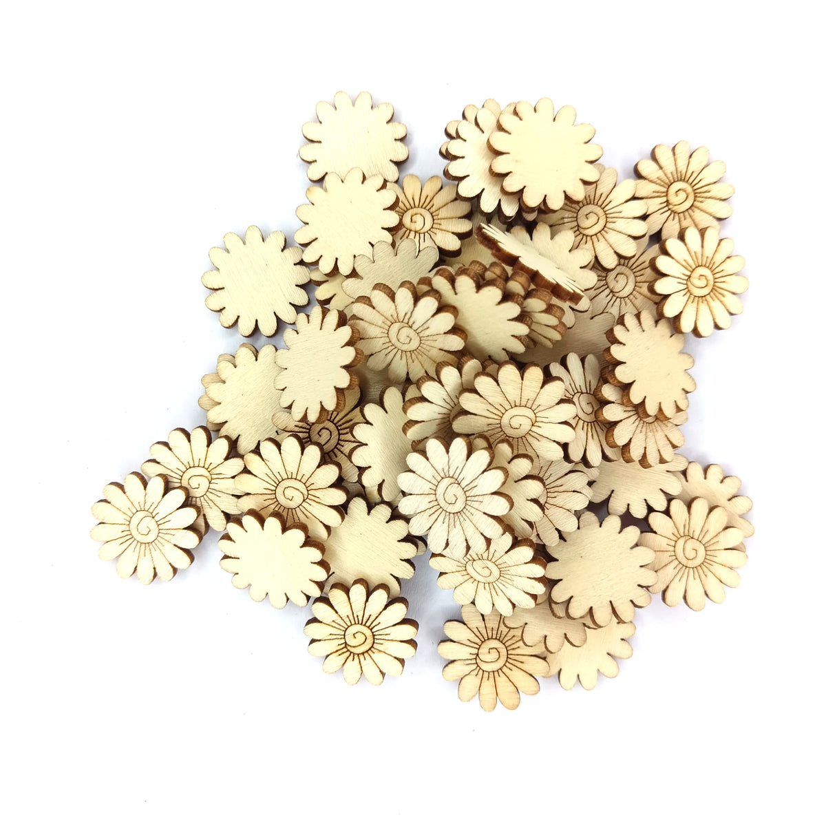 A pile of small natural wood daisy-shaped craft embellishments on a plain light gray background.