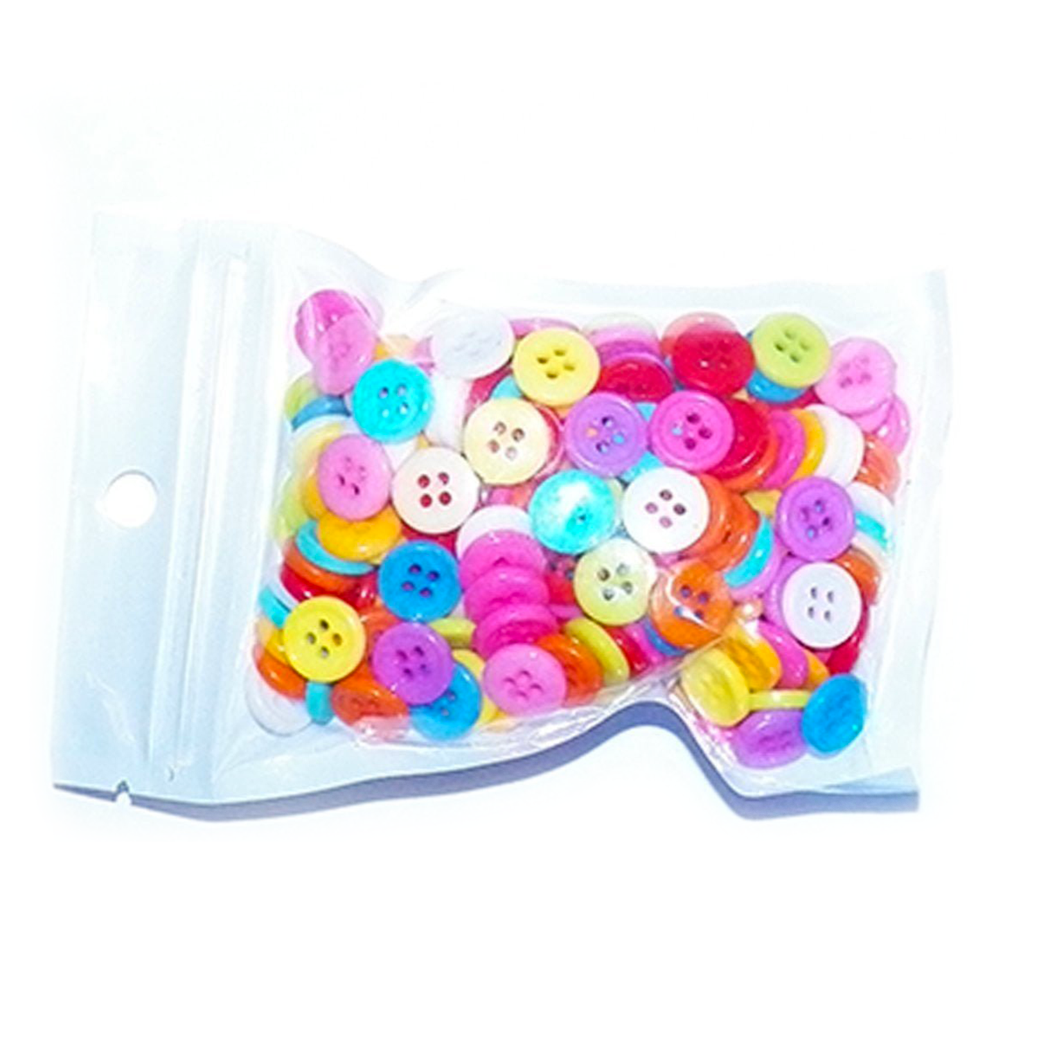 Assorted colorful buttons in a clear plastic bag on a white background
