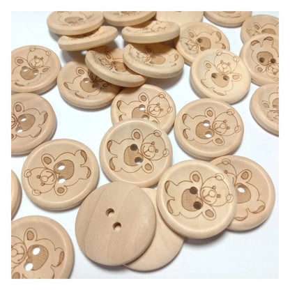 Wooden buttons with teddy bear designs on a white background