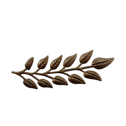 Bronze leaf branch decorative item on a white background