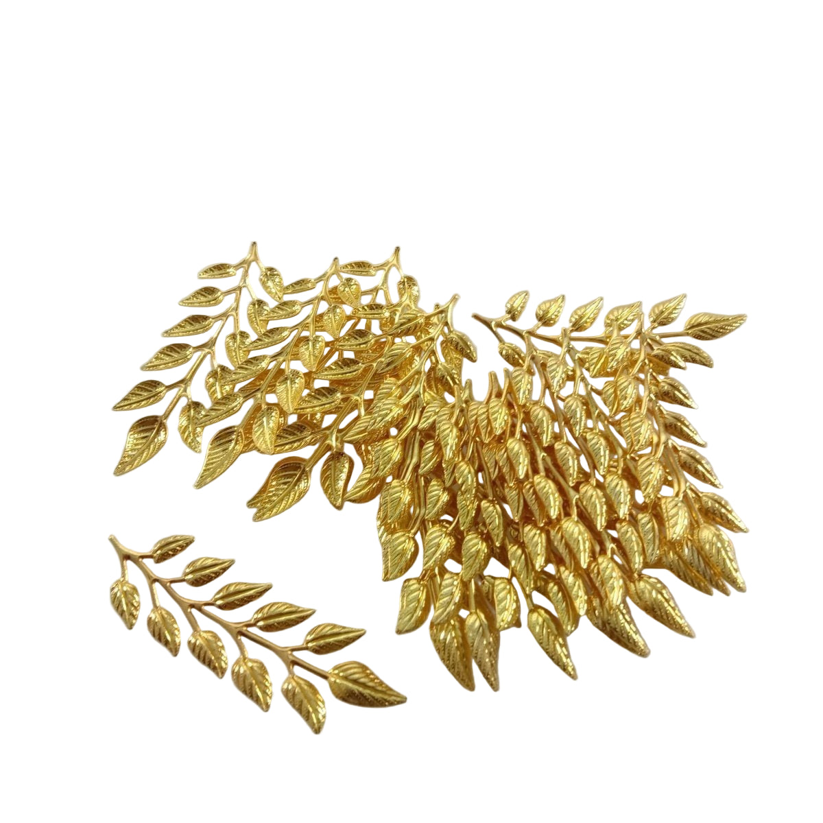 Gold leaf embellishments on a white background