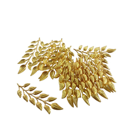 Gold leaf embellishments on a white background