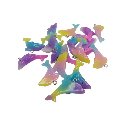 Colorful dolphin-shaped toys on a white background