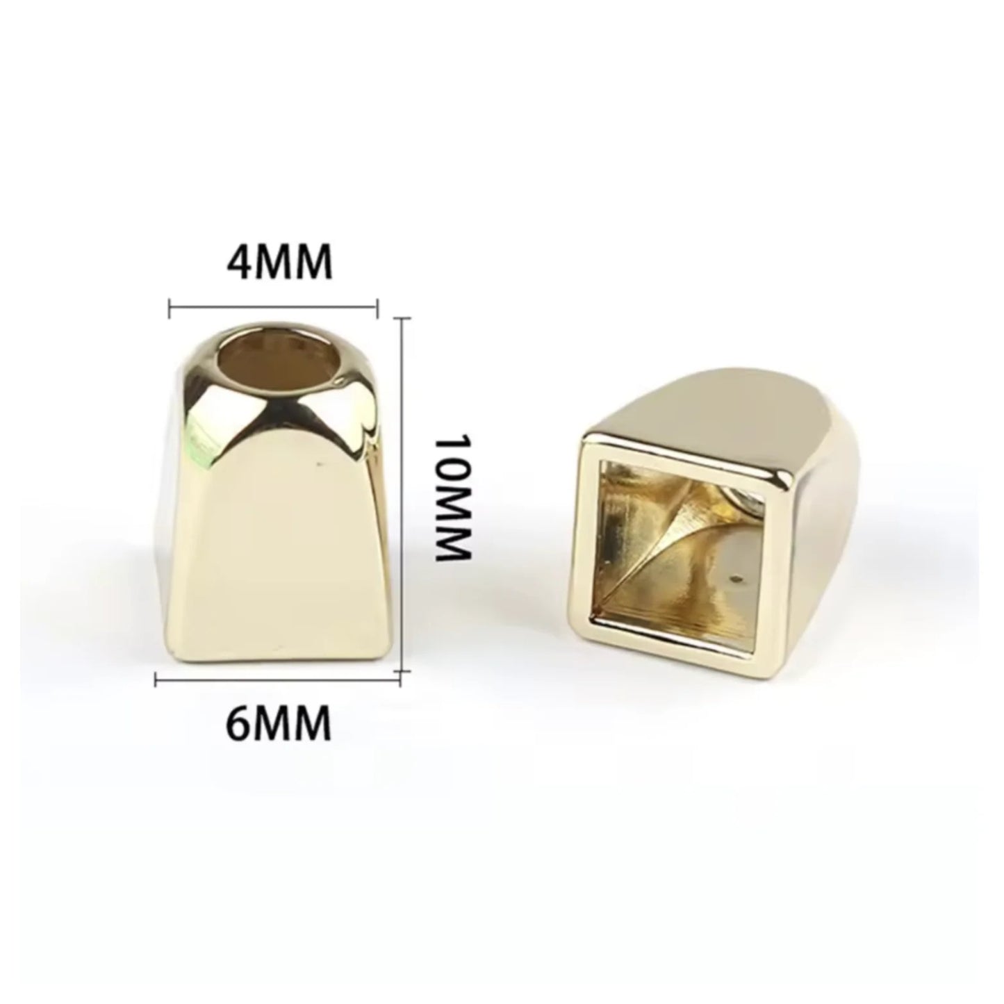 Two gold coloured metal rope pull ends with measurements on a white background