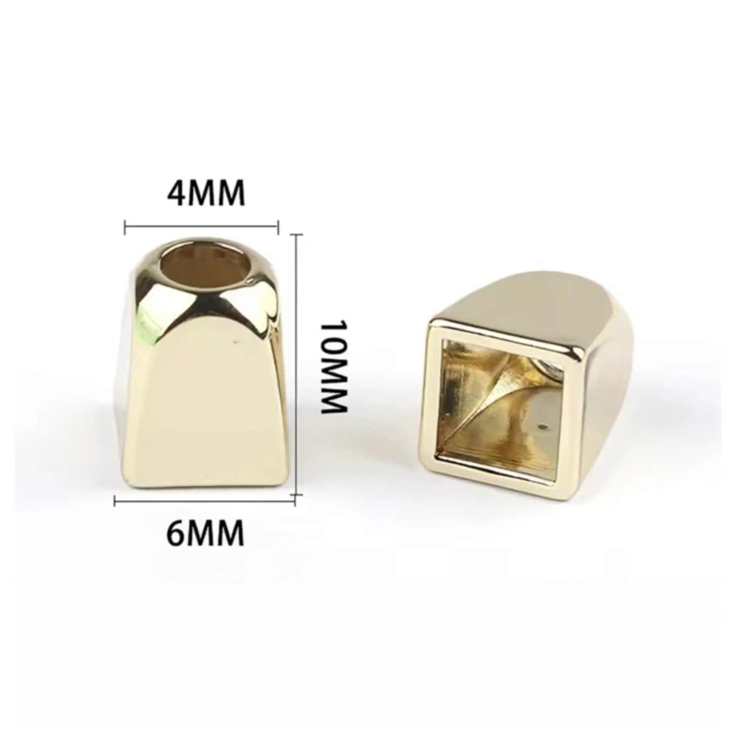 Two gold coloured metal rope pull ends with measurements on a white background