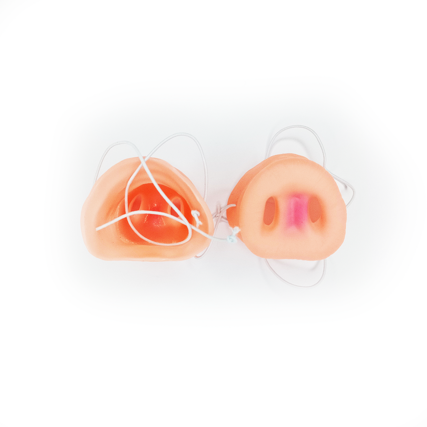 Two pig nose masks with strap on a white background