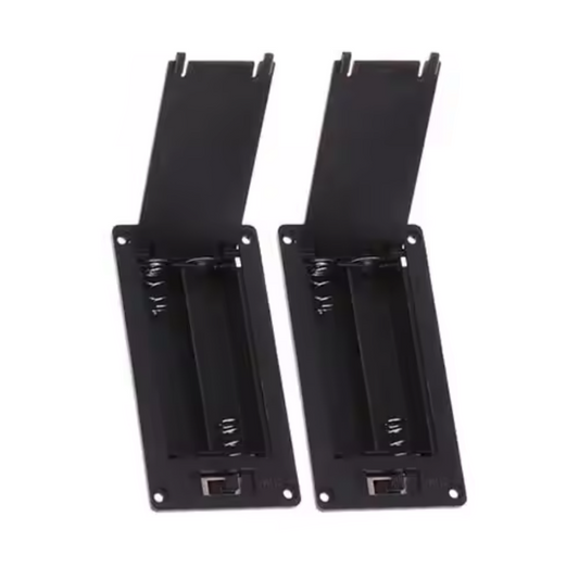 Set of two black 2xAAA panel mount battery holders on a white background