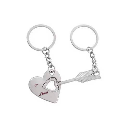 Pair of silver keychains with heart and arrow design on a white background