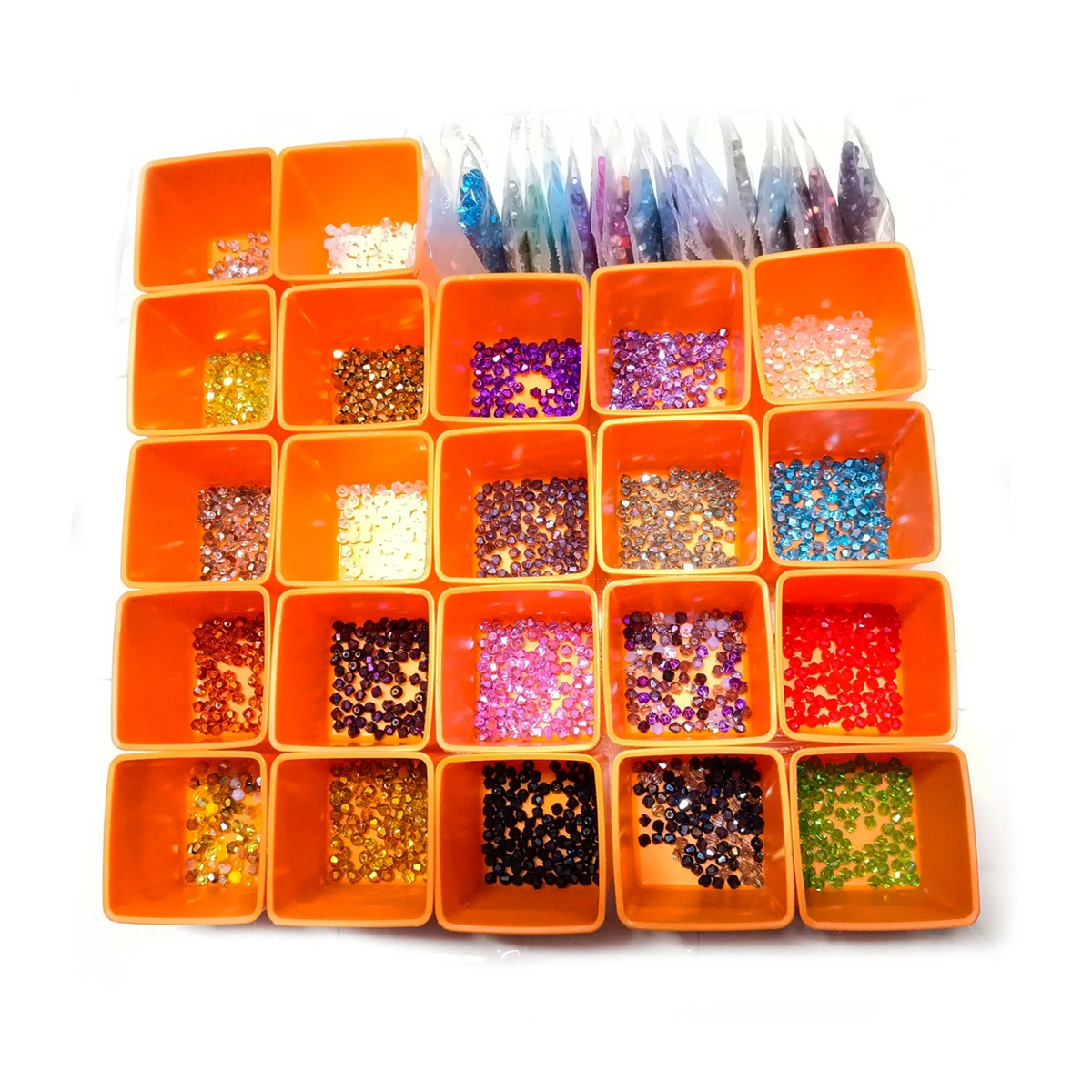 Orange container with compartments filled with various colored beads and sequins on a white background