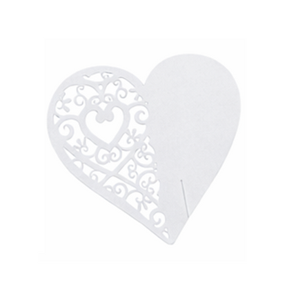 Pearl white heart-shaped cardboard wedding table placeholder with intricate cutouts on a white background