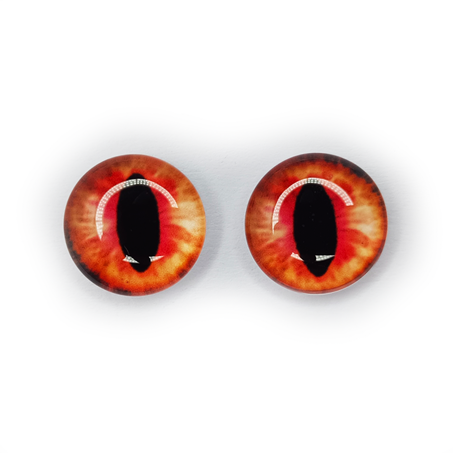 Pair of red and orange glass eyes on a white background | Asia Sell