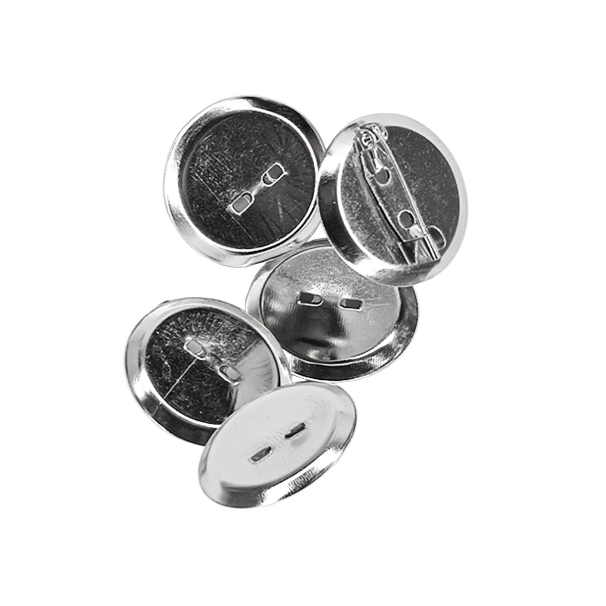 Five silver metal pin-back buttons shown from different angles on a light gray background, displaying both the front button face and the back safety pin clasp mechanism.