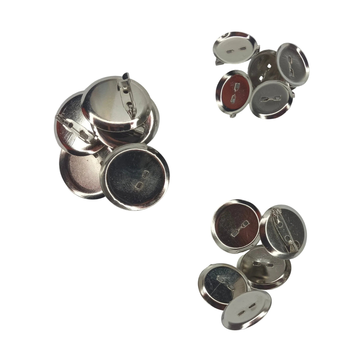 Several small round metallic pin-back buttons shown from the back on a plain white background.