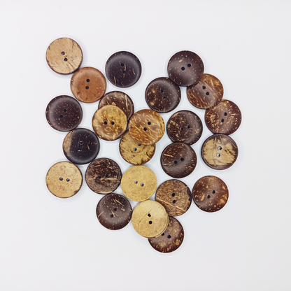 Collection of coconut shell buttons on a white background
