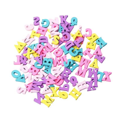 Pastel-coloured wooden alphabet letters scattered on a white background