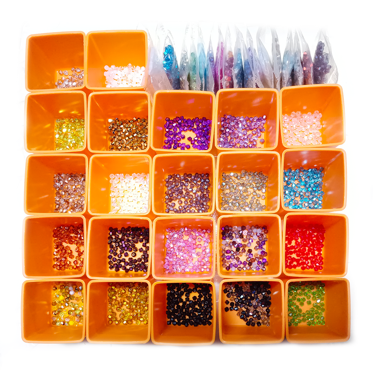 Orange container with compartments filled with various colored beads and sequins on a white background