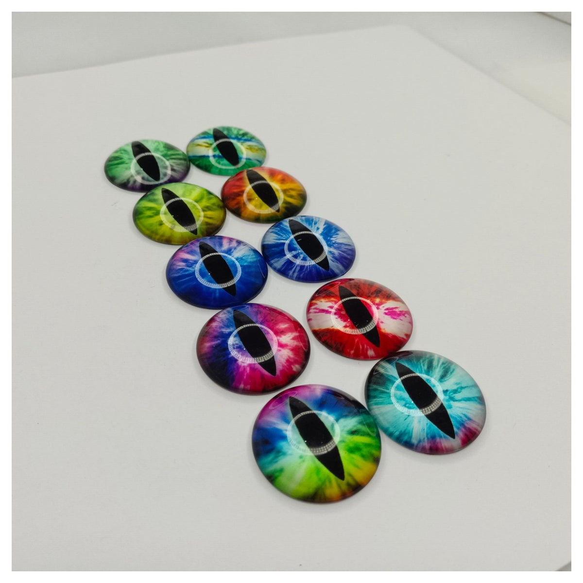 Colorful dragon eye buttons arranged on a white surface