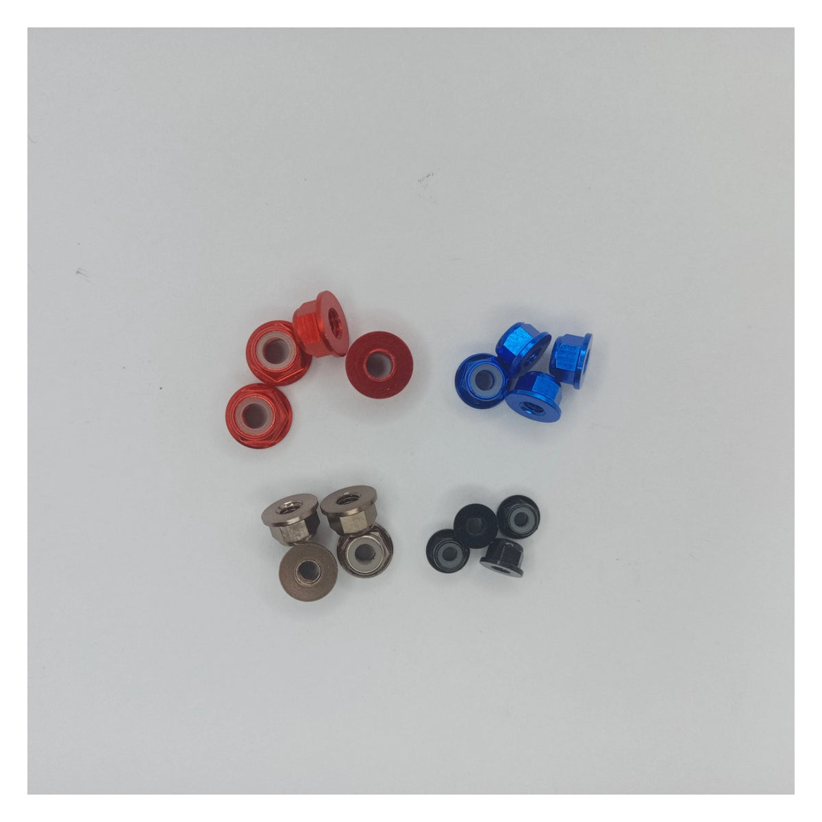 Assorted small metal bearings on a white background