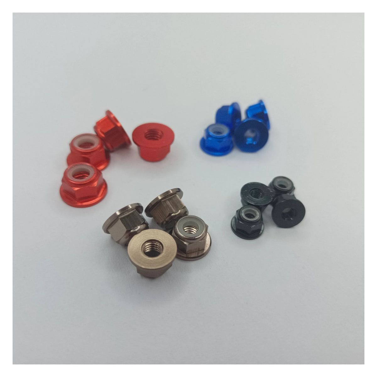 Assorted small metal bearings on a white background