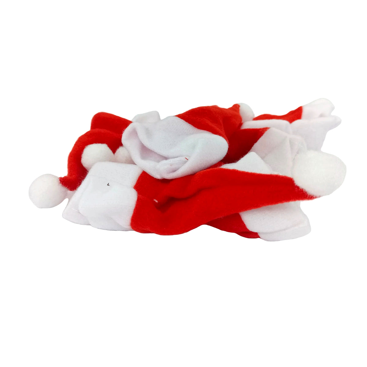 A pile of small red and white Santa hats with white pom-poms, resting on a white surface.