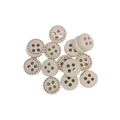 Set of wooden buttons with holes on a white background