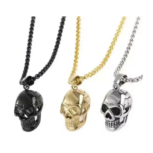 Three skull necklaces in black, gold, and silver on a white background
