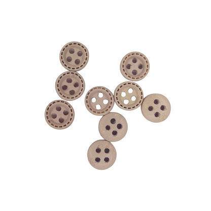 Wooden buttons with eyelets on a white background