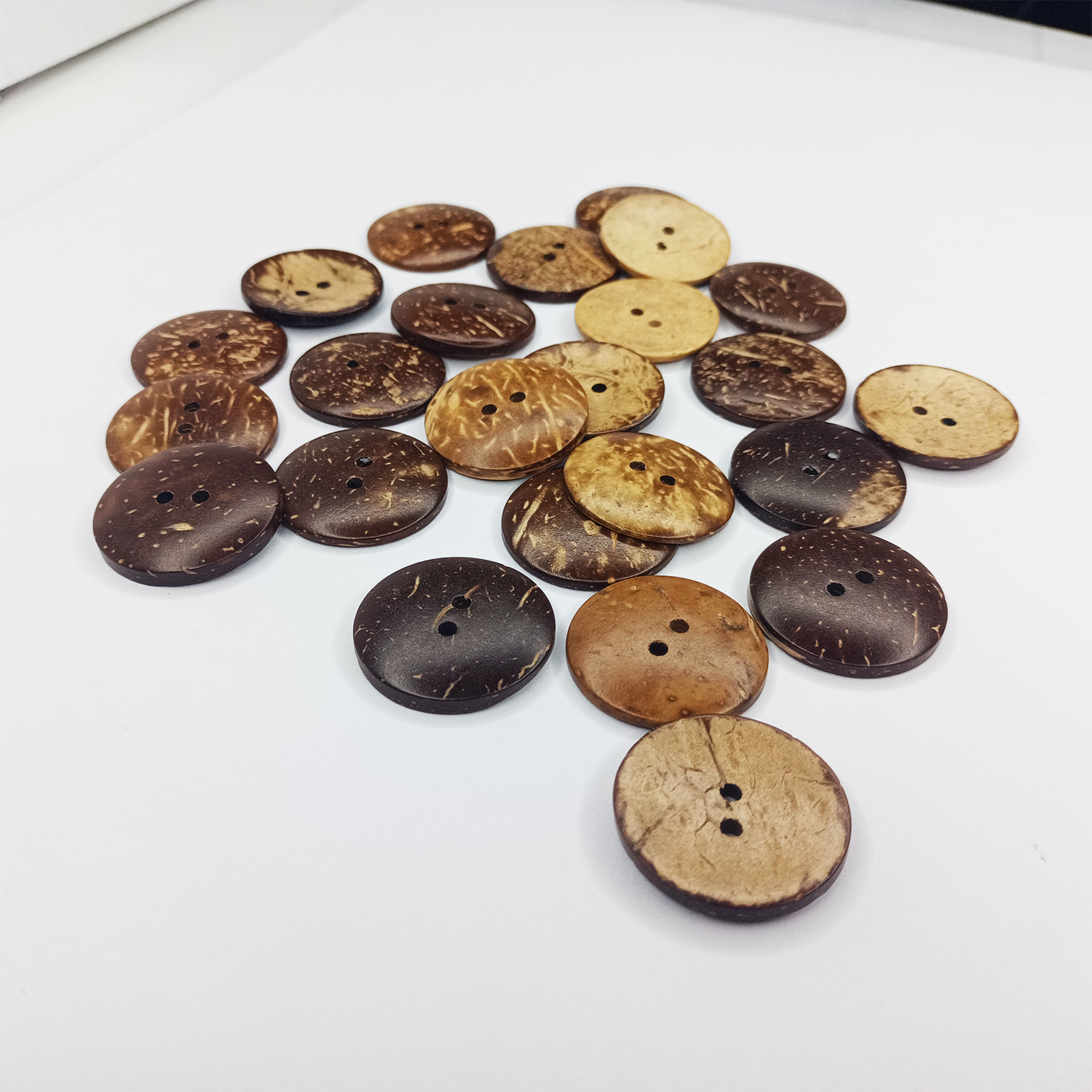 Assorted coconut buttons on a white background