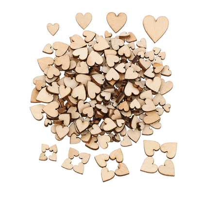 A pile of small natural wood heart-shaped craft pieces in various sizes, arranged on a plain white background.
